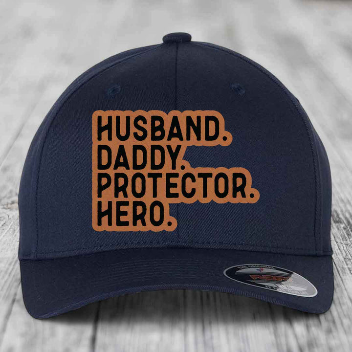 Husband Daddy Protector Hero - Leather Patch Hat - Rawhide to Black Patch - Flexfit 6277 Fitted Hat