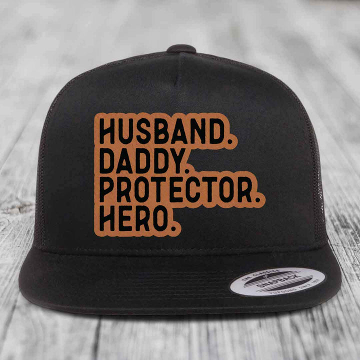 Husband Daddy Protector Hero - Leather Patch Hat - Rawhide to Black Patch - Yupoong 6006 Snapback Flatbill Hat