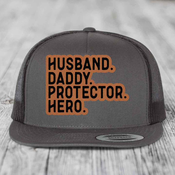 Husband Daddy Protector Hero - Leather Patch Hat - Rawhide to Black Patch - Yupoong 6006 Snapback Flatbill Hat