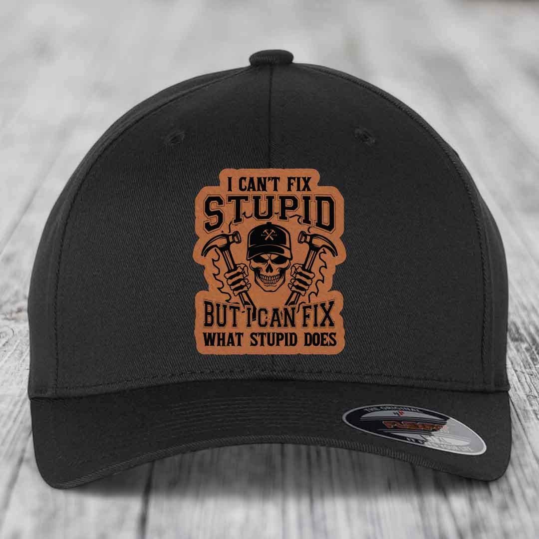 Black baseball cap with brown leather patch featuring skull holding hammers and text &