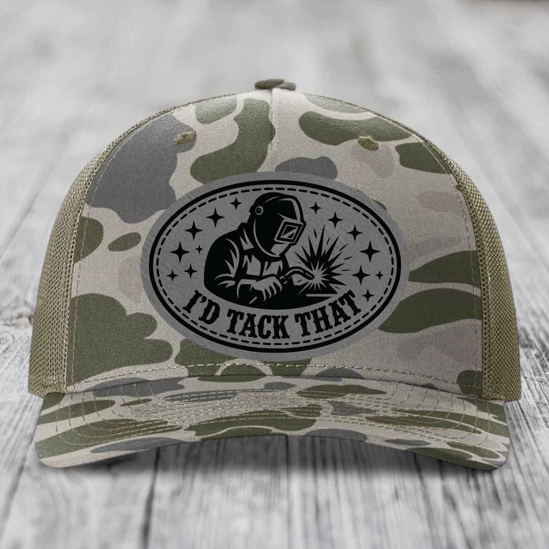 Camouflage trucker hat with black oval patch showing welder and text &