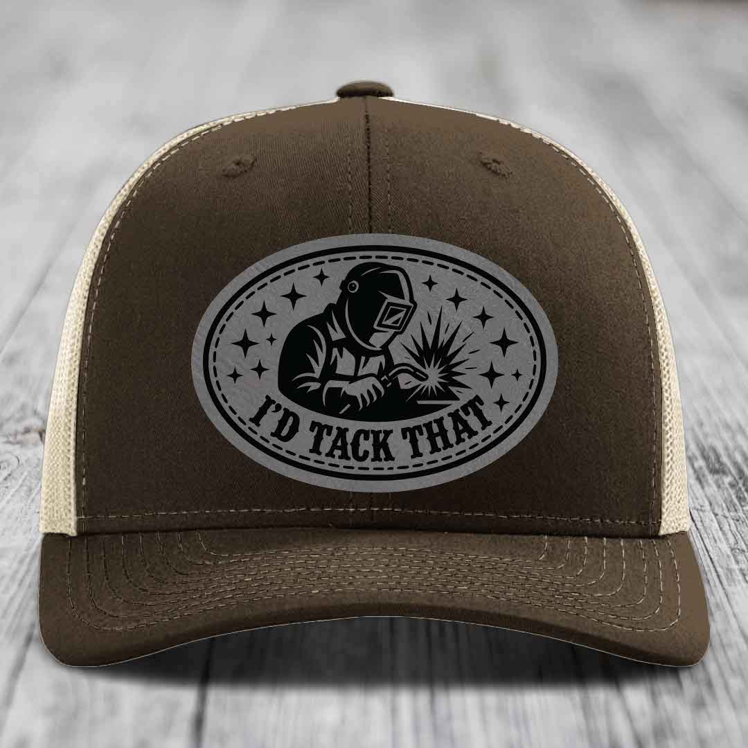 Brown trucker hat with beige mesh back and gray oval patch showing welder and text &