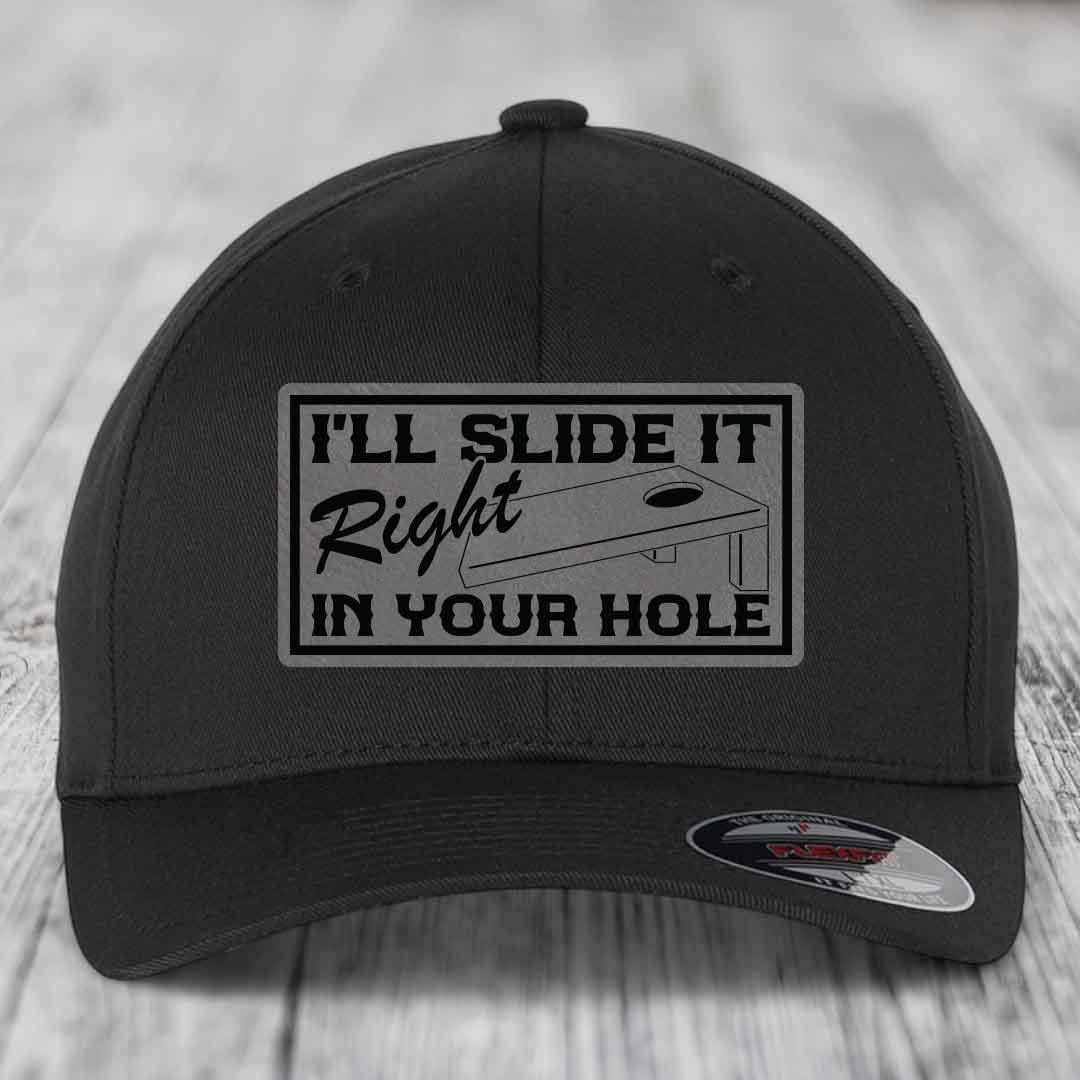 Black baseball cap with rectangular patch reading &