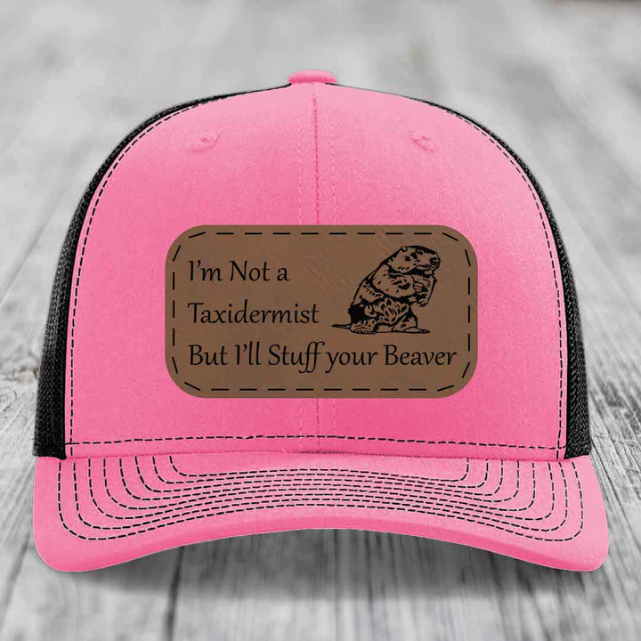 Pink trucker hat with brown leather patch reading &