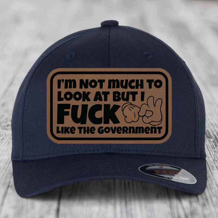 Im Not Much To Look At, But I F*ck Like The Government - Leather Patch Hat - Dark Brown to Black Patch - Flexfit 6277 Fitted Hat