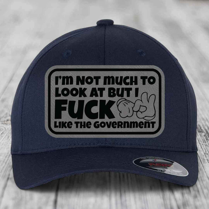 Im Not Much To Look At, But I F*ck Like The Government - Leather Patch Hat - Grey to Black Patch - Flexfit 6277 Fitted Hat
