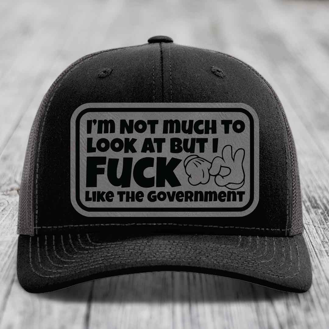 Im Not Much To Look At, But I F*ck Like The Government - Leather Patch Hat - Grey to Black Patch - Richardson 112 Snapback Trucker Hat