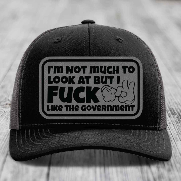 Im Not Much To Look At, But I F*ck Like The Government - Leather Patch Hat - Grey to Black Patch - Richardson 112 Snapback Trucker Hat