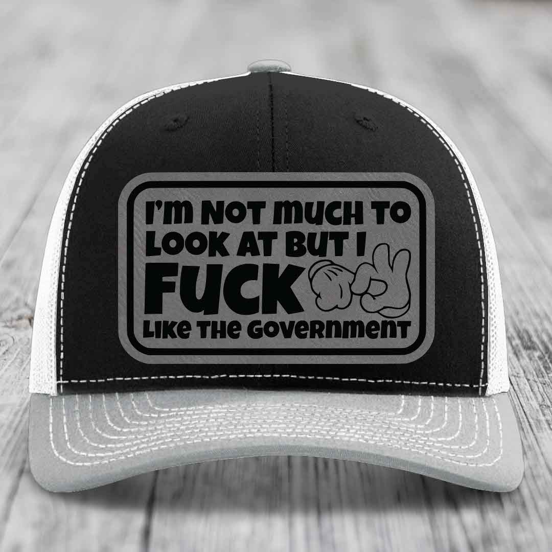 Im Not Much To Look At, But I F*ck Like The Government - Leather Patch Hat - Grey to Black Patch - Richardson 112 Snapback Trucker Hat