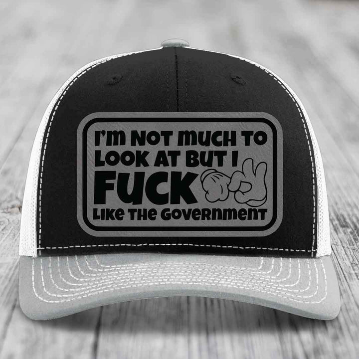Im Not Much To Look At, But I F*ck Like The Government - Leather Patch Hat - Grey to Black Patch - Richardson 112 Snapback Trucker Hat