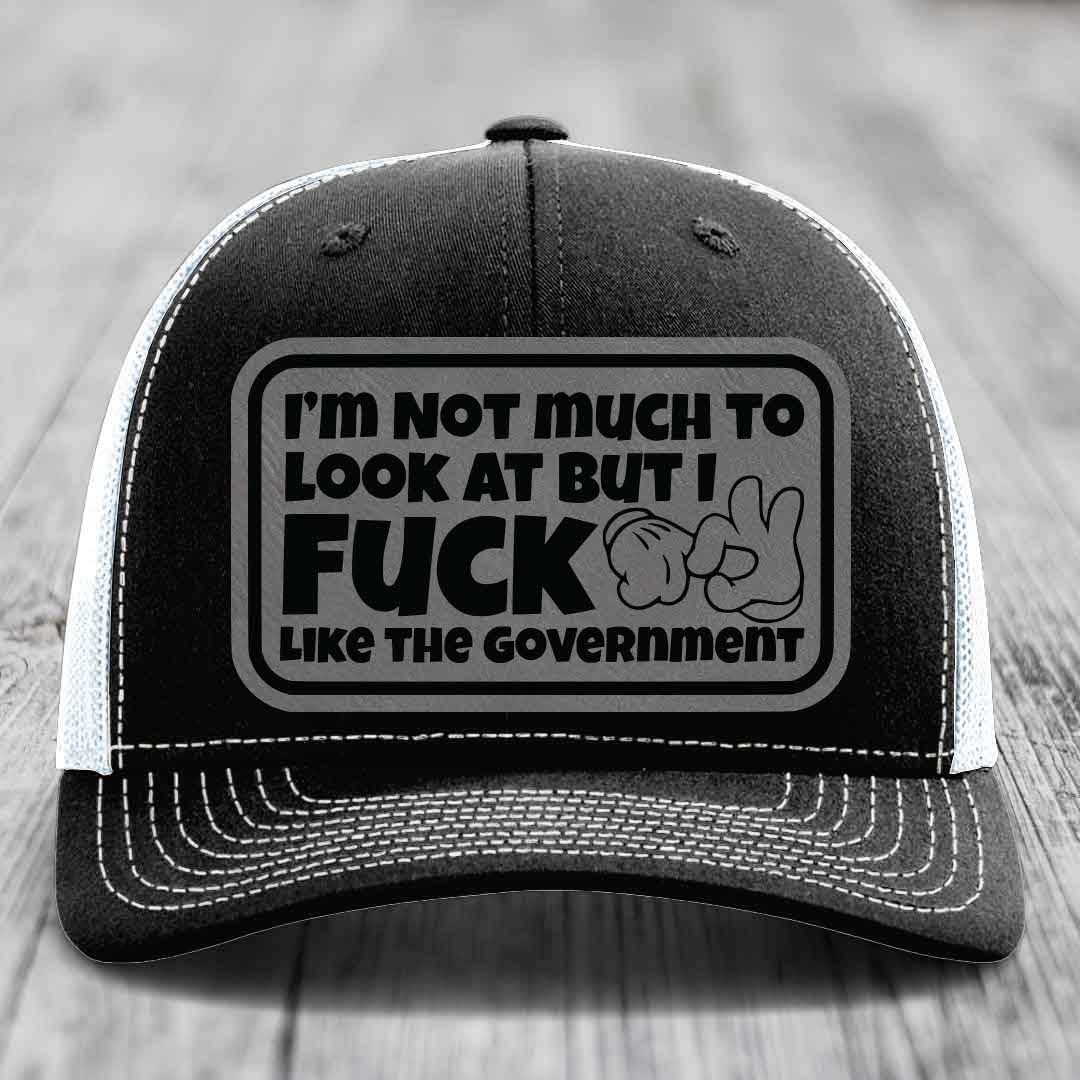 Im Not Much To Look At, But I F*ck Like The Government - Leather Patch Hat - Grey to Black Patch - Richardson 112 Snapback Trucker Hat