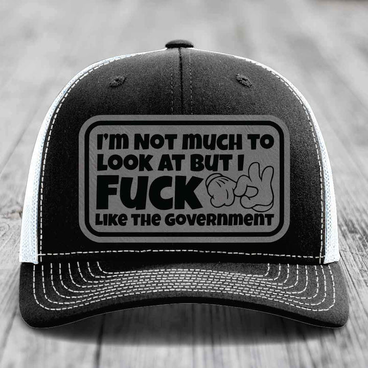 Im Not Much To Look At, But I F*ck Like The Government - Leather Patch Hat - Grey to Black Patch - Richardson 112 Snapback Trucker Hat