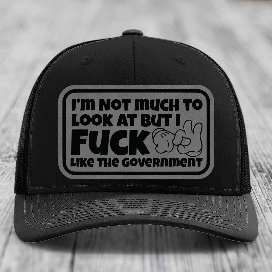 Im Not Much To Look At, But I F*ck Like The Government - Leather Patch Hat - Grey to Black Patch - Richardson 112 Snapback Trucker Hat