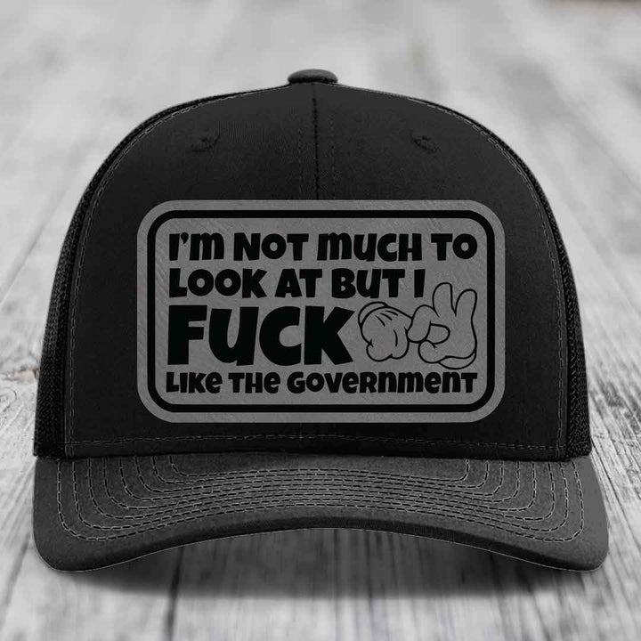 Im Not Much To Look At, But I F*ck Like The Government - Leather Patch Hat - Grey to Black Patch - Richardson 112 Snapback Trucker Hat