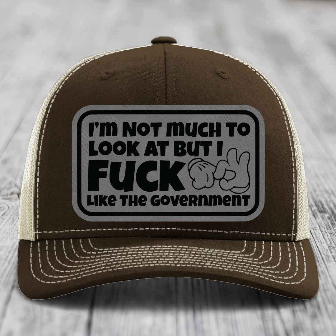 Im Not Much To Look At, But I F*ck Like The Government - Leather Patch Hat - Grey to Black Patch - Richardson 112 Snapback Trucker Hat