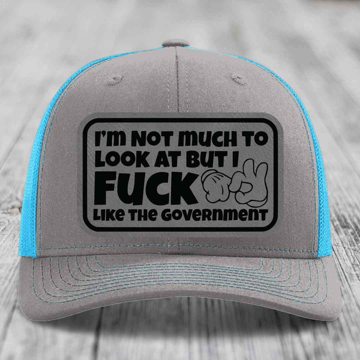 Im Not Much To Look At, But I F*ck Like The Government - Leather Patch Hat - Grey to Black Patch - Richardson 112 Snapback Trucker Hat