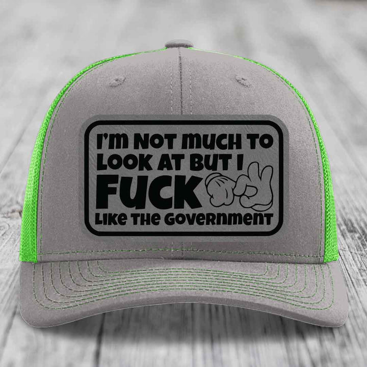 Im Not Much To Look At, But I F*ck Like The Government - Leather Patch Hat - Grey to Black Patch - Richardson 112 Snapback Trucker Hat