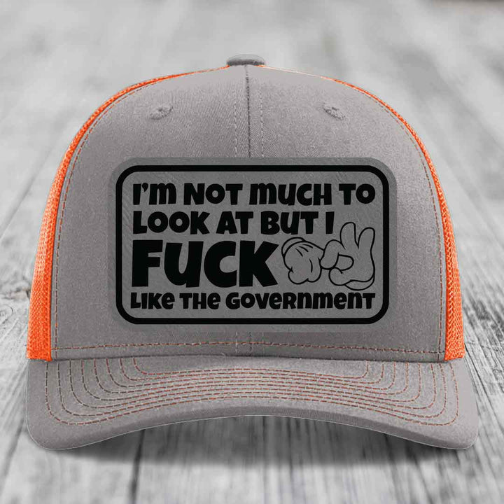 Im Not Much To Look At, But I F*ck Like The Government - Leather Patch Hat - Grey to Black Patch - Richardson 112 Snapback Trucker Hat