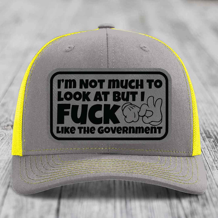 Im Not Much To Look At, But I F*ck Like The Government - Leather Patch Hat - Grey to Black Patch - Richardson 112 Snapback Trucker Hat