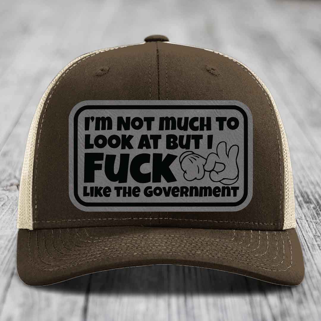 Im Not Much To Look At, But I F*ck Like The Government - Leather Patch Hat - Grey to Black Patch - Richardson 112 Snapback Trucker Hat