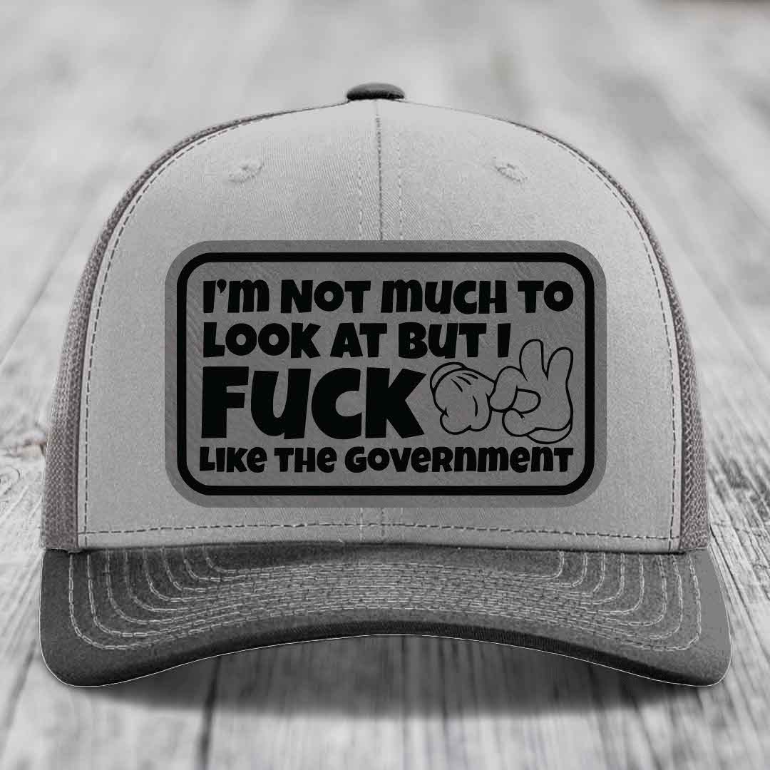 Im Not Much To Look At, But I F*ck Like The Government - Leather Patch Hat - Grey to Black Patch - Richardson 112 Snapback Trucker Hat