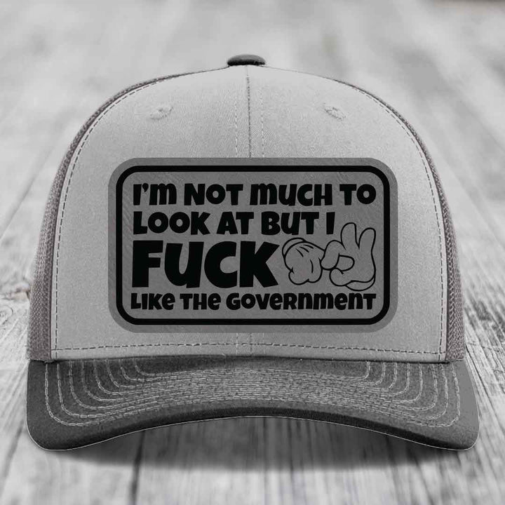Im Not Much To Look At, But I F*ck Like The Government - Leather Patch Hat - Grey to Black Patch - Richardson 112 Snapback Trucker Hat