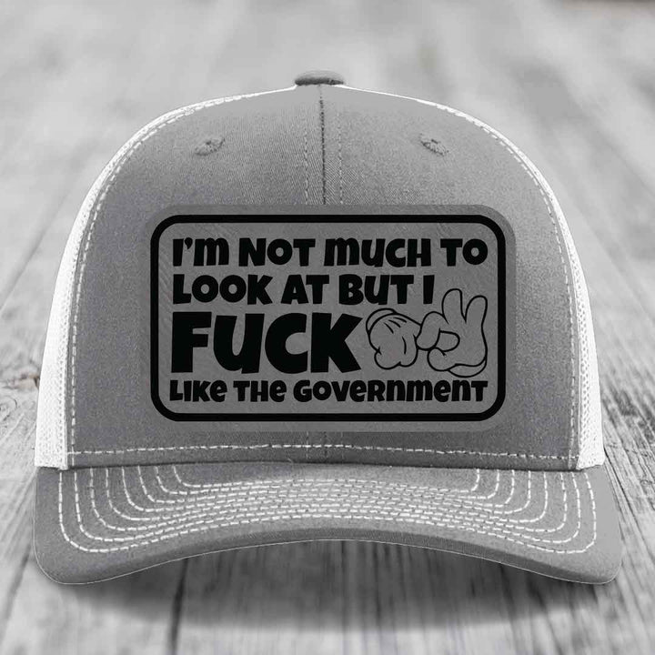 Im Not Much To Look At, But I F*ck Like The Government - Leather Patch Hat - Grey to Black Patch - Richardson 112 Snapback Trucker Hat