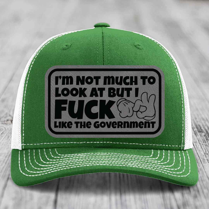 Im Not Much To Look At, But I F*ck Like The Government - Leather Patch Hat - Grey to Black Patch - Richardson 112 Snapback Trucker Hat