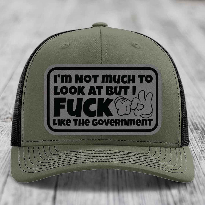 Im Not Much To Look At, But I F*ck Like The Government - Leather Patch Hat - Grey to Black Patch - Richardson 112 Snapback Trucker Hat