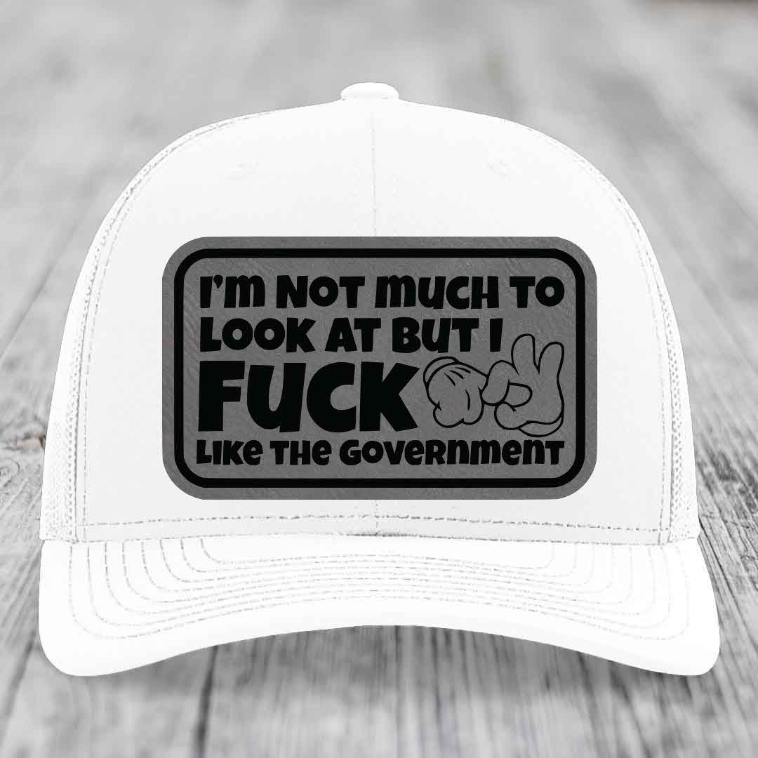 Im Not Much To Look At, But I F*ck Like The Government - Leather Patch Hat - Grey to Black Patch - Richardson 112 Snapback Trucker Hat