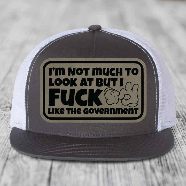 Im Not Much To Look At, But I F*ck Like The Government - Leather Patch Hat - Light Brown to Black Patch - Yupoong 6006 Snapback Flatbill Hat