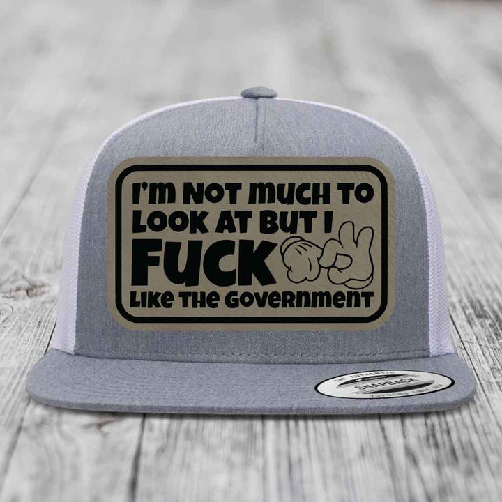 Im Not Much To Look At, But I F*ck Like The Government - Leather Patch Hat - Light Brown to Black Patch - Yupoong 6006 Snapback Flatbill Hat