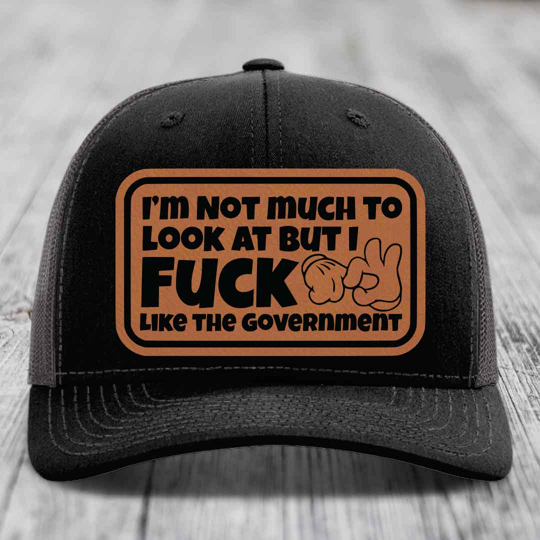 Im Not Much To Look At, But I F*ck Like The Government - Leather Patch Hat - Rawhide to Black Patch - Richardson 112 Snapback Trucker Hat