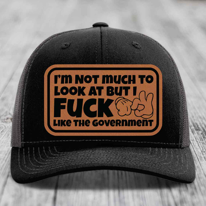 Im Not Much To Look At, But I F*ck Like The Government - Leather Patch Hat - Rawhide to Black Patch - Richardson 112 Snapback Trucker Hat