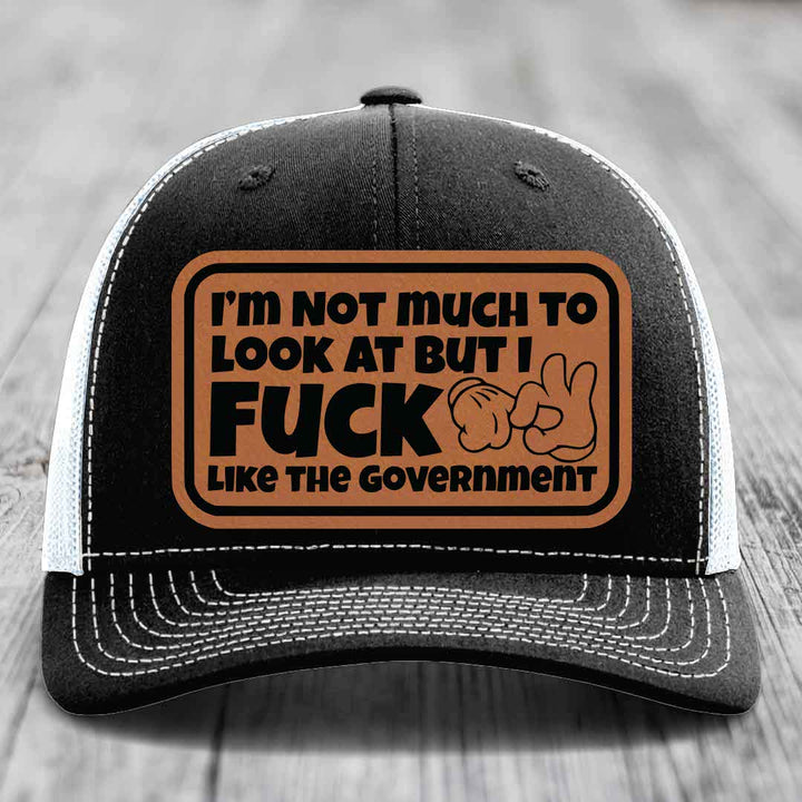 Im Not Much To Look At, But I F*ck Like The Government - Leather Patch Hat - Rawhide to Black Patch - Richardson 112 Snapback Trucker Hat