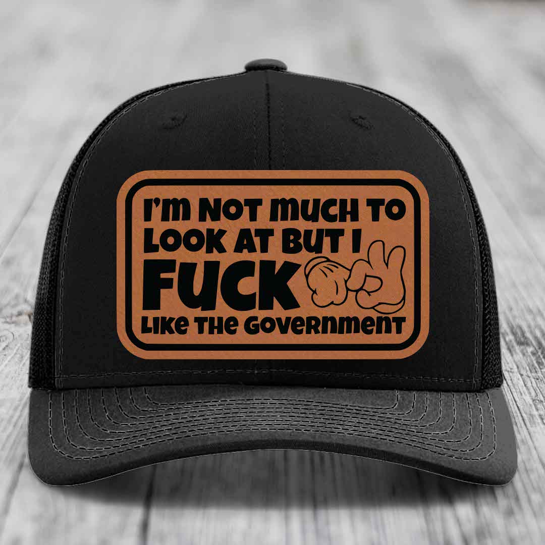 Im Not Much To Look At, But I F*ck Like The Government - Leather Patch Hat - Rawhide to Black Patch - Richardson 112 Snapback Trucker Hat