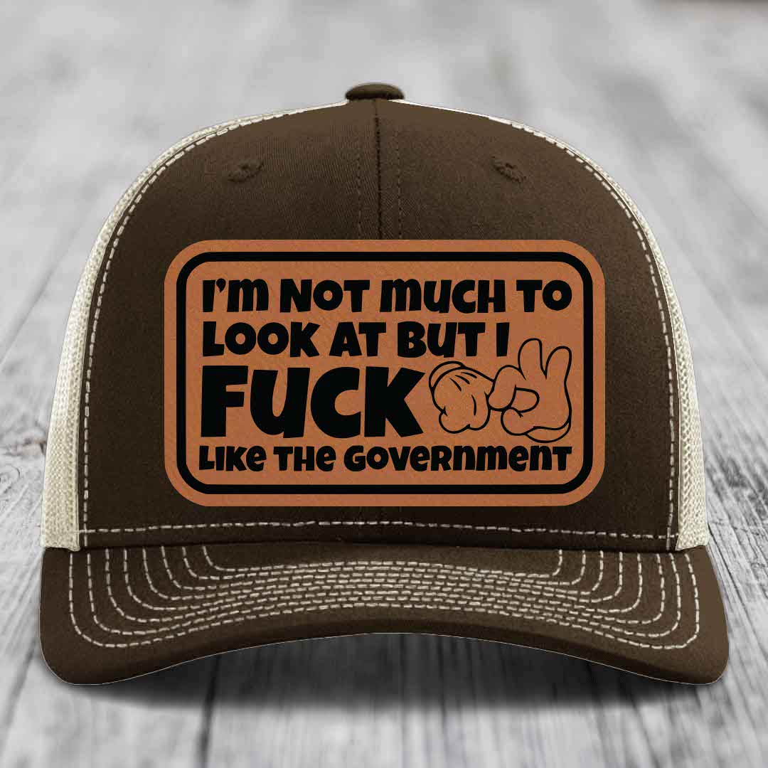 Im Not Much To Look At, But I F*ck Like The Government - Leather Patch Hat - Rawhide to Black Patch - Richardson 112 Snapback Trucker Hat