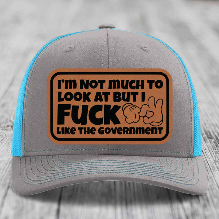 Im Not Much To Look At, But I F*ck Like The Government - Leather Patch Hat - Rawhide to Black Patch - Richardson 112 Snapback Trucker Hat