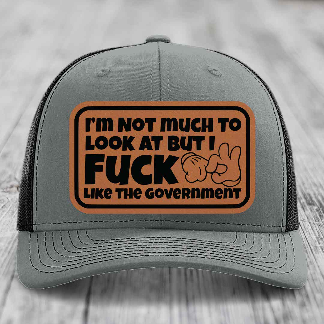 Im Not Much To Look At, But I F*ck Like The Government - Leather Patch Hat - Rawhide to Black Patch - Richardson 112 Snapback Trucker Hat