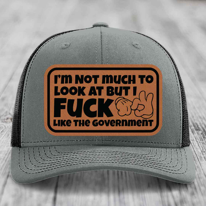 Im Not Much To Look At, But I F*ck Like The Government - Leather Patch Hat - Rawhide to Black Patch - Richardson 112 Snapback Trucker Hat