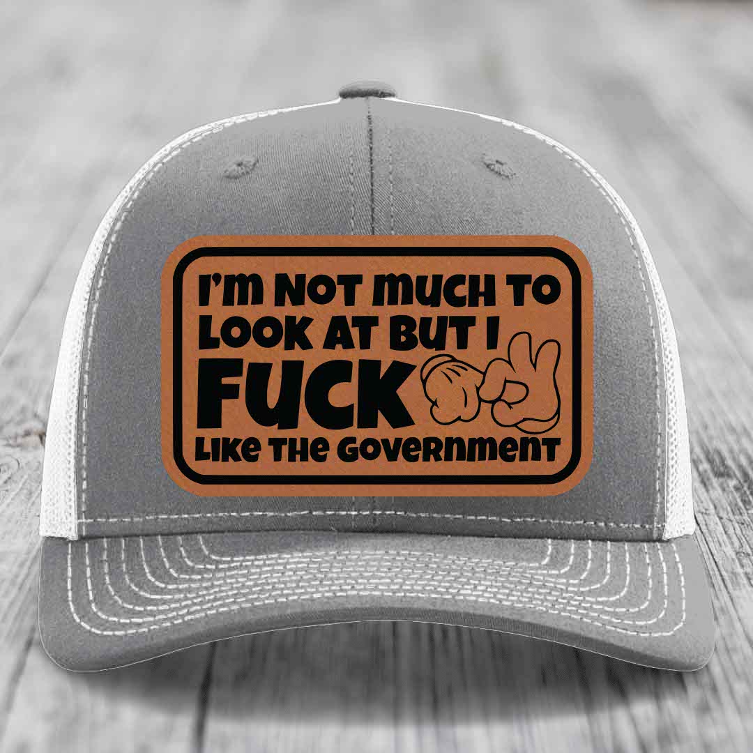 Im Not Much To Look At, But I F*ck Like The Government - Leather Patch Hat - Rawhide to Black Patch - Richardson 112 Snapback Trucker Hat