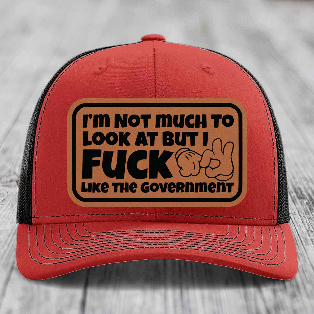 Im Not Much To Look At, But I F*ck Like The Government - Leather Patch Hat - Rawhide to Black Patch - Richardson 112 Snapback Trucker Hat