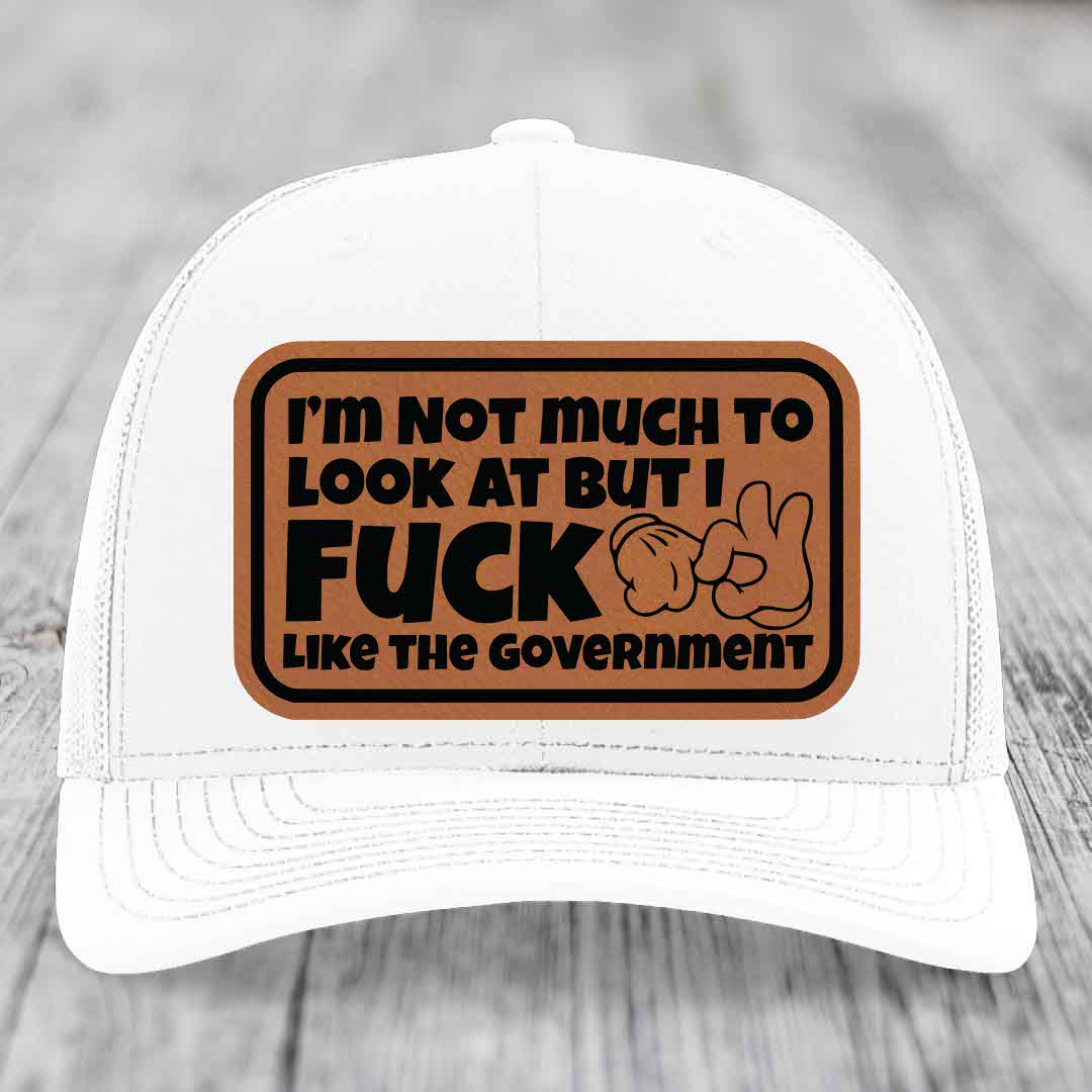 Im Not Much To Look At, But I F*ck Like The Government - Leather Patch Hat - Rawhide to Black Patch - Richardson 112 Snapback Trucker Hat