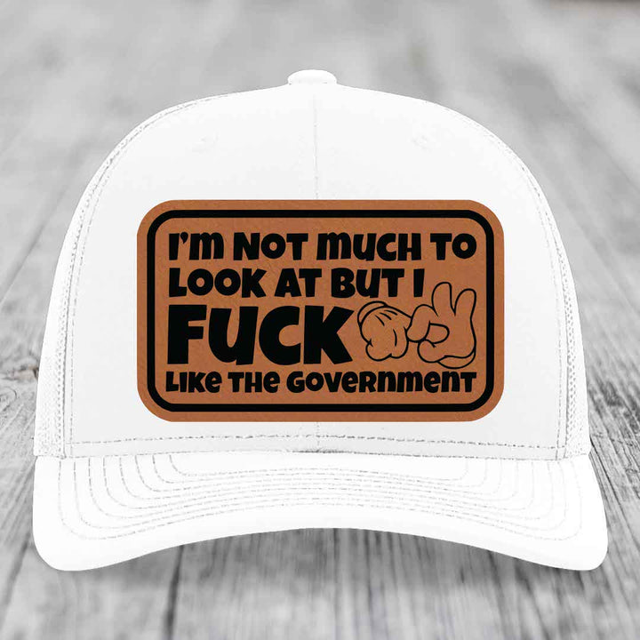 Im Not Much To Look At, But I F*ck Like The Government - Leather Patch Hat - Rawhide to Black Patch - Richardson 112 Snapback Trucker Hat