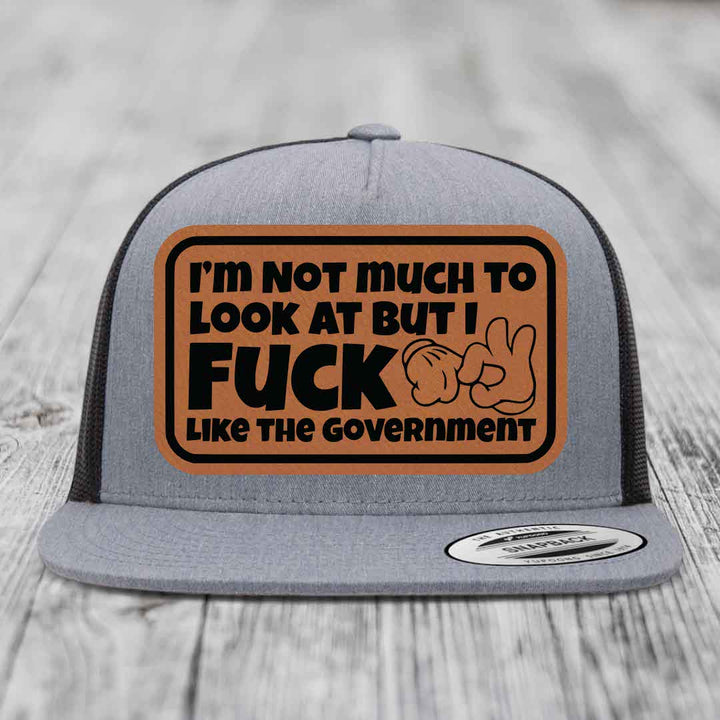 Im Not Much To Look At, But I F*ck Like The Government - Leather Patch Hat - Rawhide to Black Patch - Yupoong 6006 Snapback Flatbill Hat