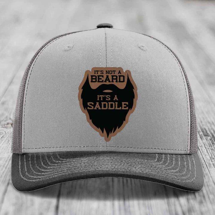 Its Not A Beard, Its A Saddle - Leather Patch Hat - Dark Brown to Black Patch - Richardson 112 Snapback Trucker Hat