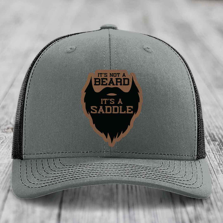 Its Not A Beard, Its A Saddle - Leather Patch Hat - Dark Brown to Black Patch - Richardson 112 Snapback Trucker Hat