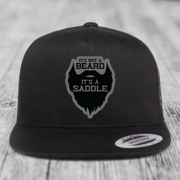 Its Not A Beard, Its A Saddle - Leather Patch Hat - Grey to Black Patch - Yupoong 6006 Snapback Flatbill Hat