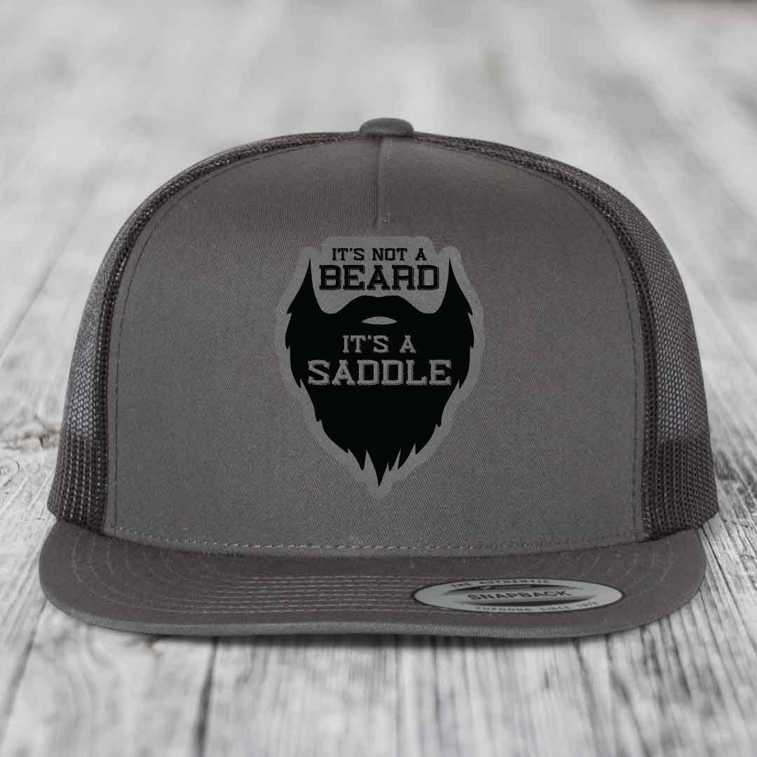 Its Not A Beard, Its A Saddle - Leather Patch Hat - Grey to Black Patch - Yupoong 6006 Snapback Flatbill Hat