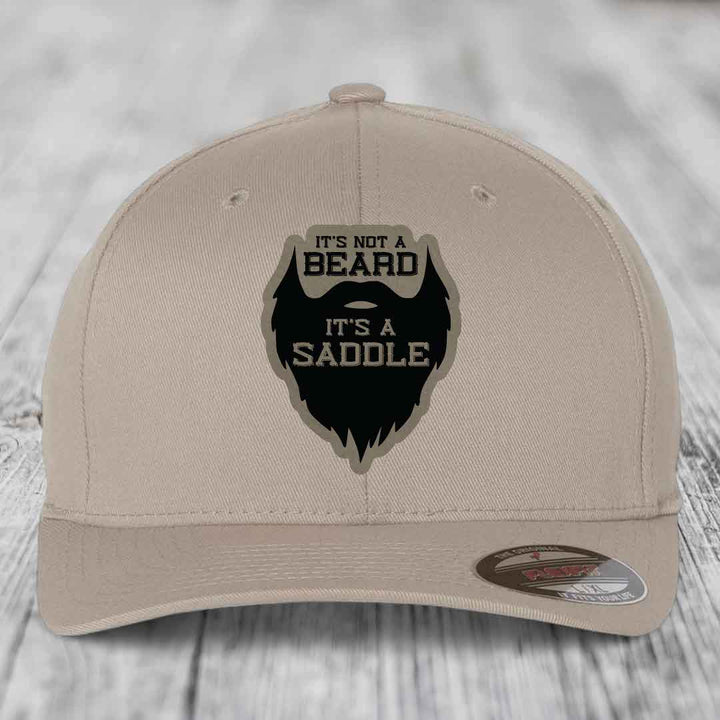 Its Not A Beard, Its A Saddle - Leather Patch Hat - Light Brown to Black Patch - Flexfit 6277 Fitted Hat